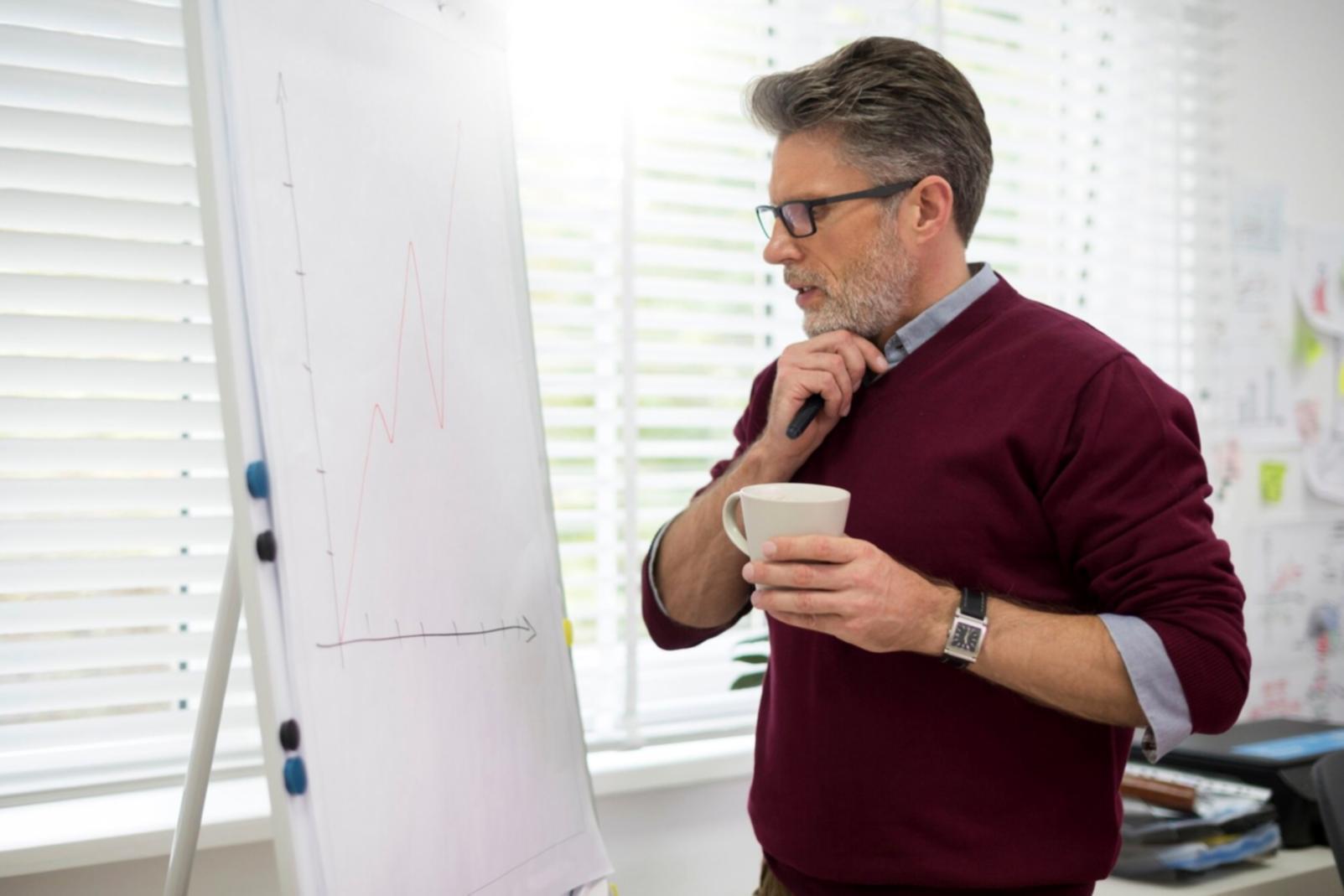 Financial analyst reviewing modeling resources and documentation